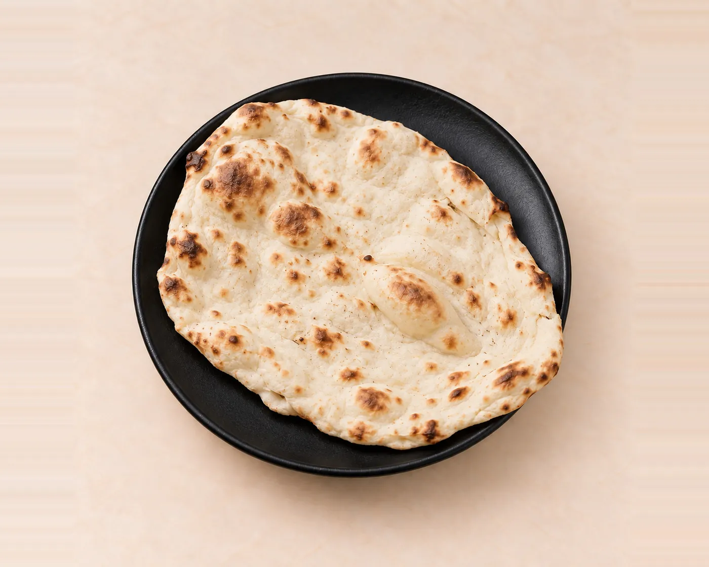 Histoire du naan, du four tandoor au naan au fromage